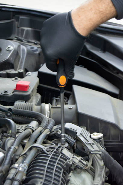 istock hand with screwdriver auto mechanic in car repair 1090377958