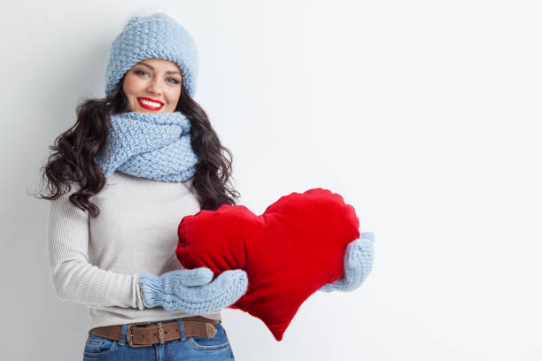 istock Woman with red heart shape pillow 1090380110