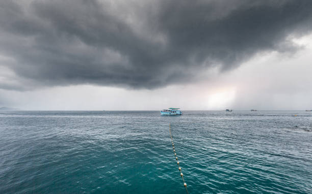 istock Traveling boat with passenger go to island while raining strom near comes 1090384330