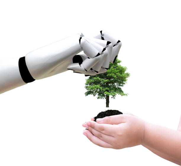 istock Robot hand holding a tree technology and environment put it into the hands of children 1090386116