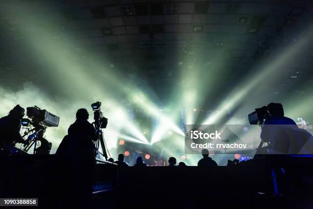 Silhouette Of A Group Of Cameramen Broadcasting An Event Stock Photo - Download Image Now