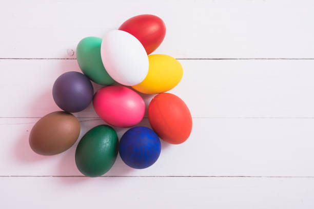 istock Colorful easter eggs clean on wooden background 1090389094