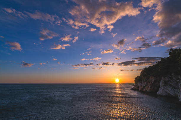 istock Sunset over the cliffs in Petrovac 1090389356
