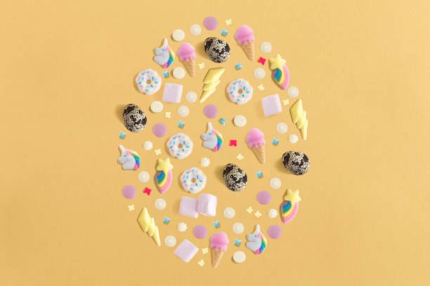istock Arrangement decoration for Happy Easter, holiday background concept. Colorful eggs, sweets and topping ornament design as big egg on yellow pastel desk with copy space. Flat lay 1090391436