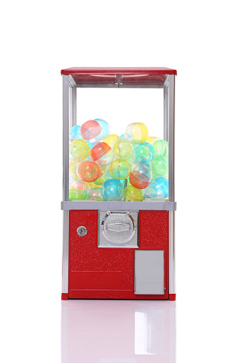 studio shot of capsule toy vending machine called GASHAPON or GACHAGACHA on white background