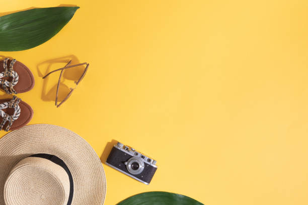 istock Summer vacation concept, top view and flat lay. Beach accessories copy space. Travel layout on yellow background 1090392288