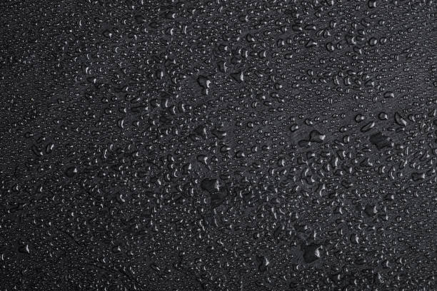istock Dark gray black slate background with water drops or natural stone texture. 1090392320