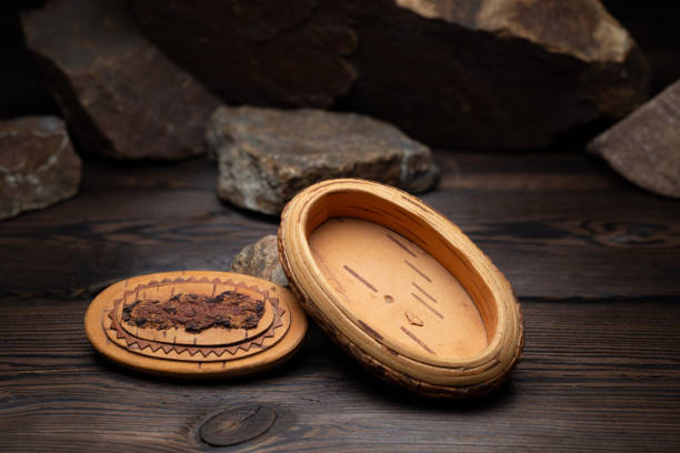 istock a small box of birch bark on a dark stone background 1090393762