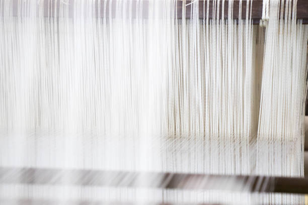 Closed up of loom with white thread background
