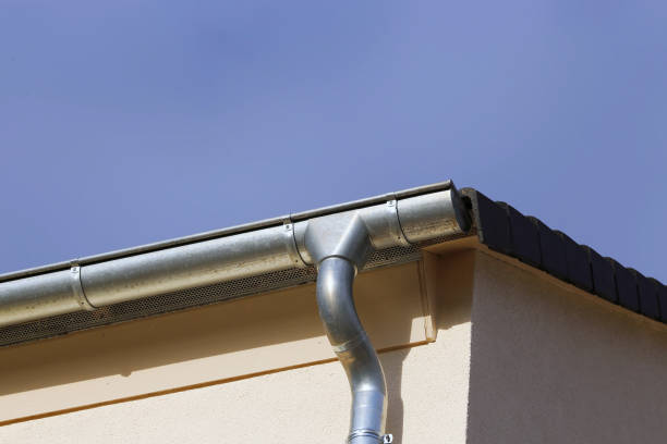 istock Roof gutter on a new tiled roof 1090399166