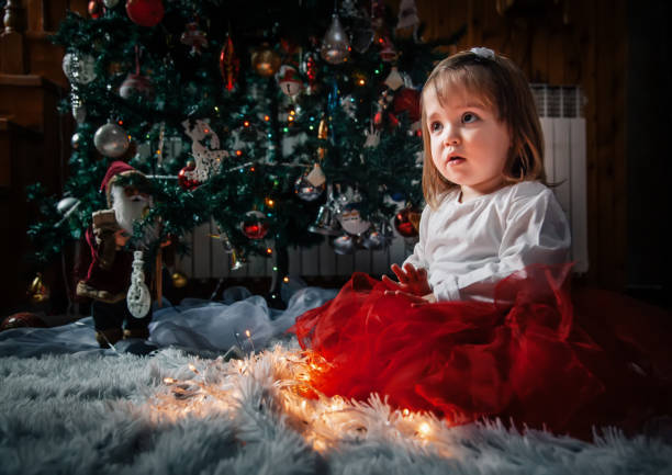 istock Girl with Christmas lights 1090400698
