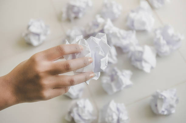 istock No idea and fail concept - Human hand holding crumpled paper and trash. 1090400744