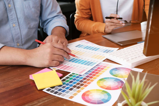 istock Graphic designer working on digital tablet. artist drawing on graphic tablet and Color swatch samples. 1090400944