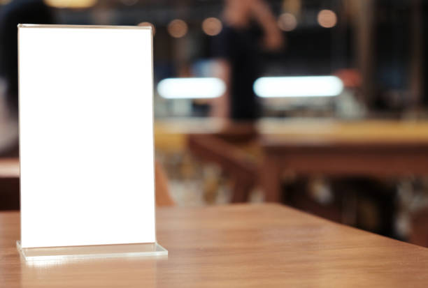 istock Menu frame standing on wood table in Bar restaurant cafe. space for text marketing promotion. 1090400968