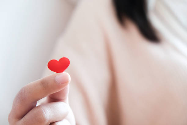 istock Valentine day love concept. Red Hart in hand with copy space. 1090401036