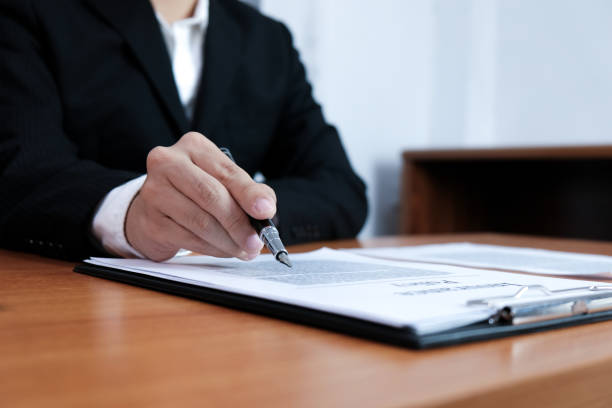 istock Sales manager giving advice application form document, considering mortgage loan offer for car and house insurance. 1090401048