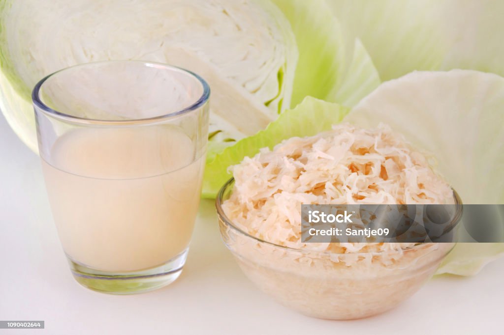 German Sauerkraut and Juice with White Cabbage German Sauerkraut and Juice with White Cabbage close up Juice - Drink Stock Photo