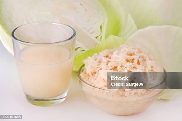 German Sauerkraut And Juice With White Cabbage Stock Photo - Download Image Now - Juice - Drink, Cabbage, Sauerkraut