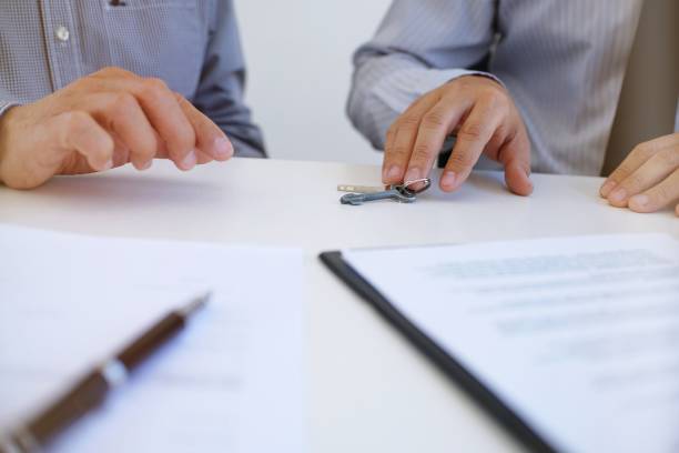 istock Sales manager giving advice application form document, considering mortgage loan offer for car and house insurance. 1090403364