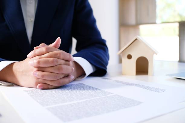 istock Sales manager giving advice application form document, considering mortgage loan offer for car and house insurance. 1090403388