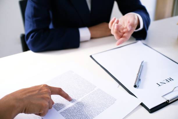 istock Sales manager giving advice application form document, considering mortgage loan offer for car and house insurance. 1090403498