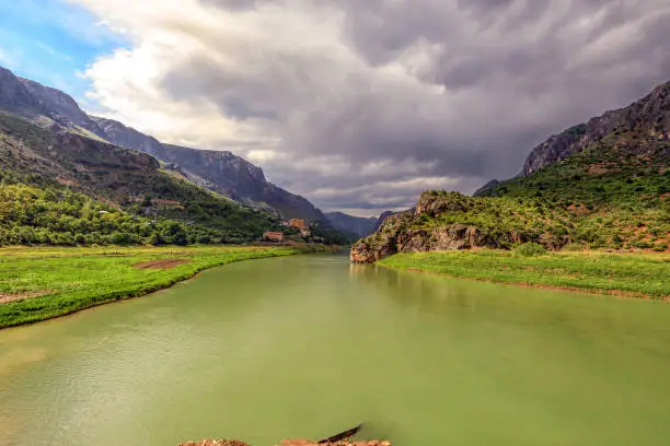 Photo of Landscape of the Euphrates River in Kemaliye, Erzincan, Turkey. The Euphrates flows through Syria and Iraq to join the Tigris in the Shatt al-Arab, which empties into the Persian Gulf.
