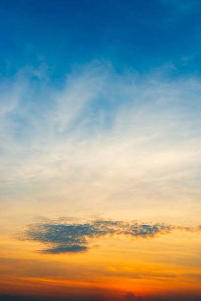 istock Cloudy sky and orange light of the sun through the clouds 1090408176