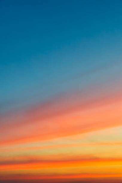 istock Cloudy sky and orange light of the sun through the clouds with copy space 1090408196