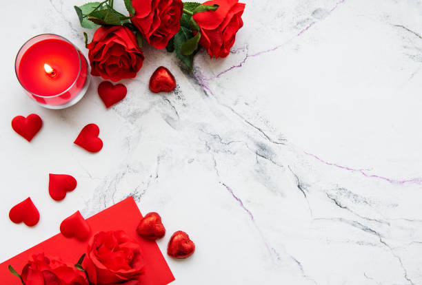 istock Valentines day romantic background - red roses, candle and hearts 1090408890