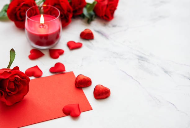 istock Valentines day romantic background - red roses, candle and hearts 1090408900