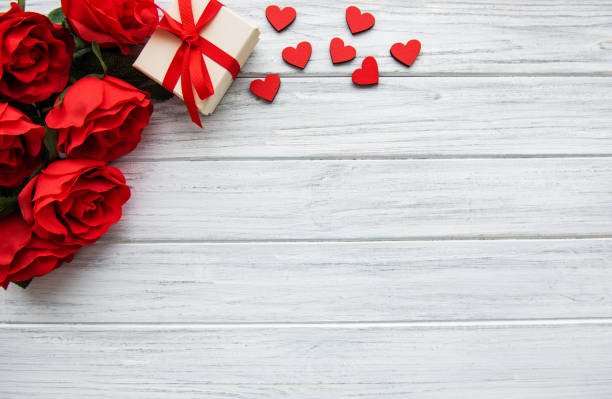 Valentine day romantic background Valentines day romantic background -  red roses, gift  and  hearts valentines present stock pictures, royalty-free photos & images