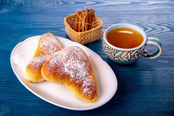 istock Sweet cakes with nuts and raisins are on the blue table 1090410268