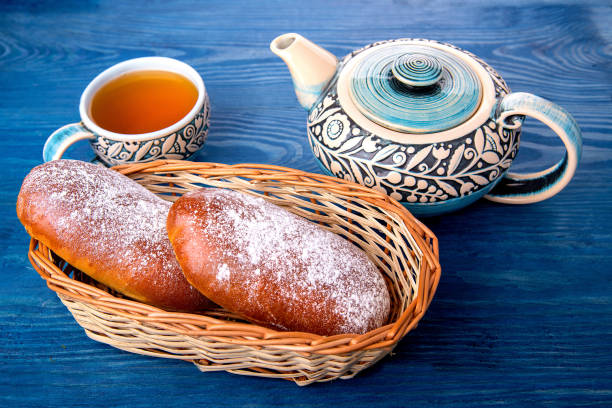 istock Sweet cakes with nuts and raisins are on the blue table 1090410274