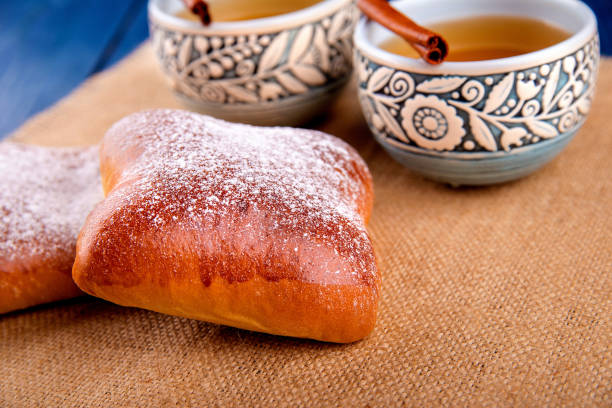 istock Sweet cakes with nuts and raisins are on the blue table 1090410330