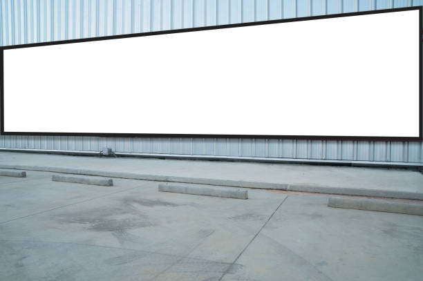 istock outdoor car parking and empty white billboard .Blank space for text and images 1090411630
