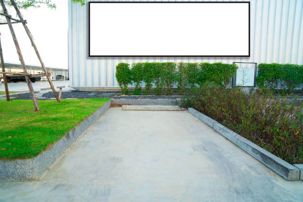 istock outdoor car parking and empty white billboard .Blank space for text and images 1090411652