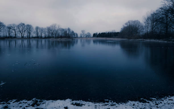 istock frozen lake - winter landscape 1090413636