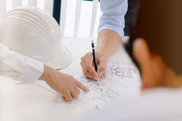 istock Colleagues interior designer Corporate Achievement Planning Design on blueprint Teamwork Concept with compasses. 1090416768