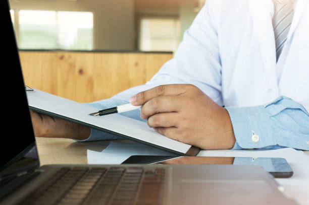 istock Medical technology network team meeting concept. Doctor hand working smart phone modern digital tablet laptop computer graphics chart interface 1090416782