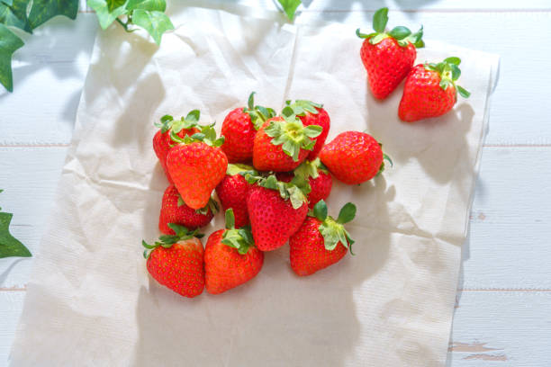 istock Fresh strawberries on wooden table 1090418526