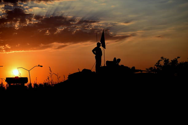 SOLDIER SOLDIER AT GUARD DURING SUNSET south sudan stock pictures, royalty-free photos & images