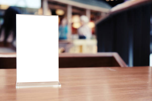 istock Menu frame standing on wood table in Bar restaurant cafe. space for text marketing promotion. 1090419196
