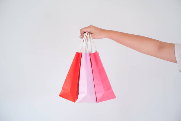 istock woman holding shopping bag 1090419228