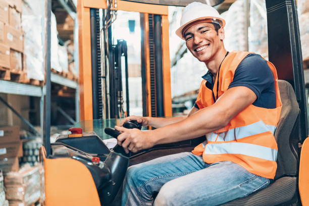 istock Young man in protective wear driving a forklift 1090422926