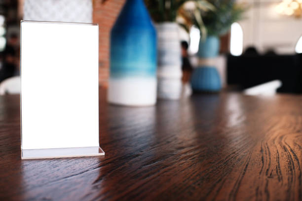 istock Menu frame standing on wood table in Bar restaurant cafe. space for text marketing promotion. 1090423890