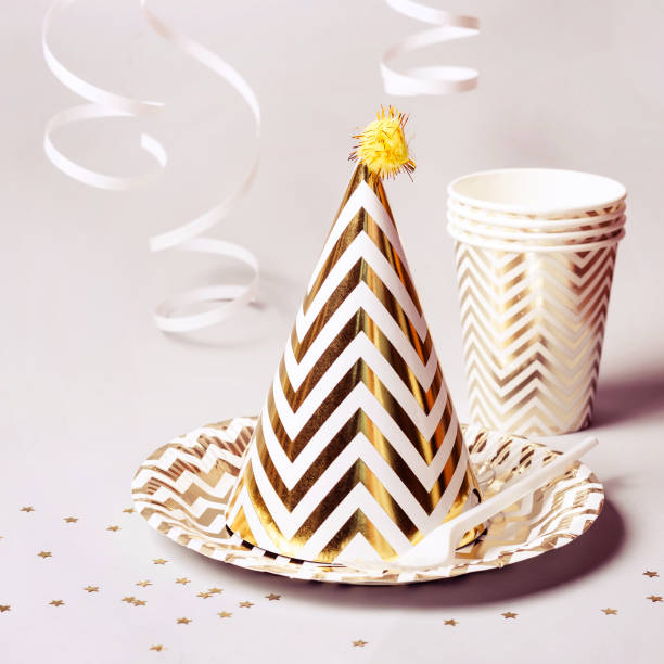 istock Golden striped cone hat and other party accessories 1090428994