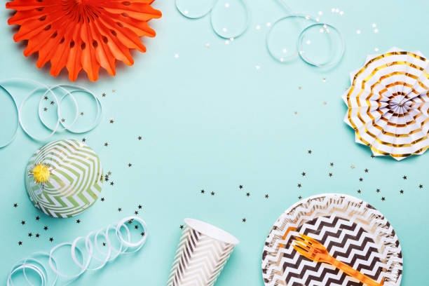 istock Frame made from accessories for party in gold on turquoise background 1090429018