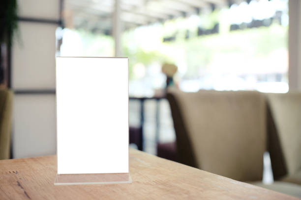 istock Menu frame standing on wood table in Bar restaurant cafe. space for text marketing promotion. 1090431028