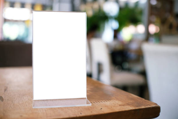 istock Menu frame standing on wood table in Bar restaurant cafe. space for text marketing promotion. 1090431038