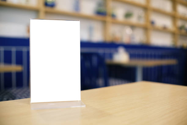 istock Menu frame standing on wood table in Bar restaurant cafe. space for text marketing promotion. 1090431044